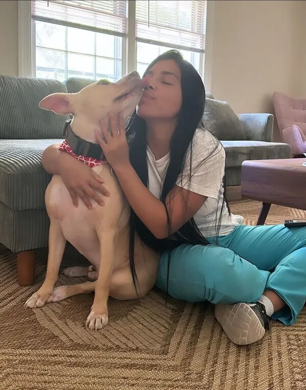 Venus the groomer with a happy dog at Fancy Pet Salon